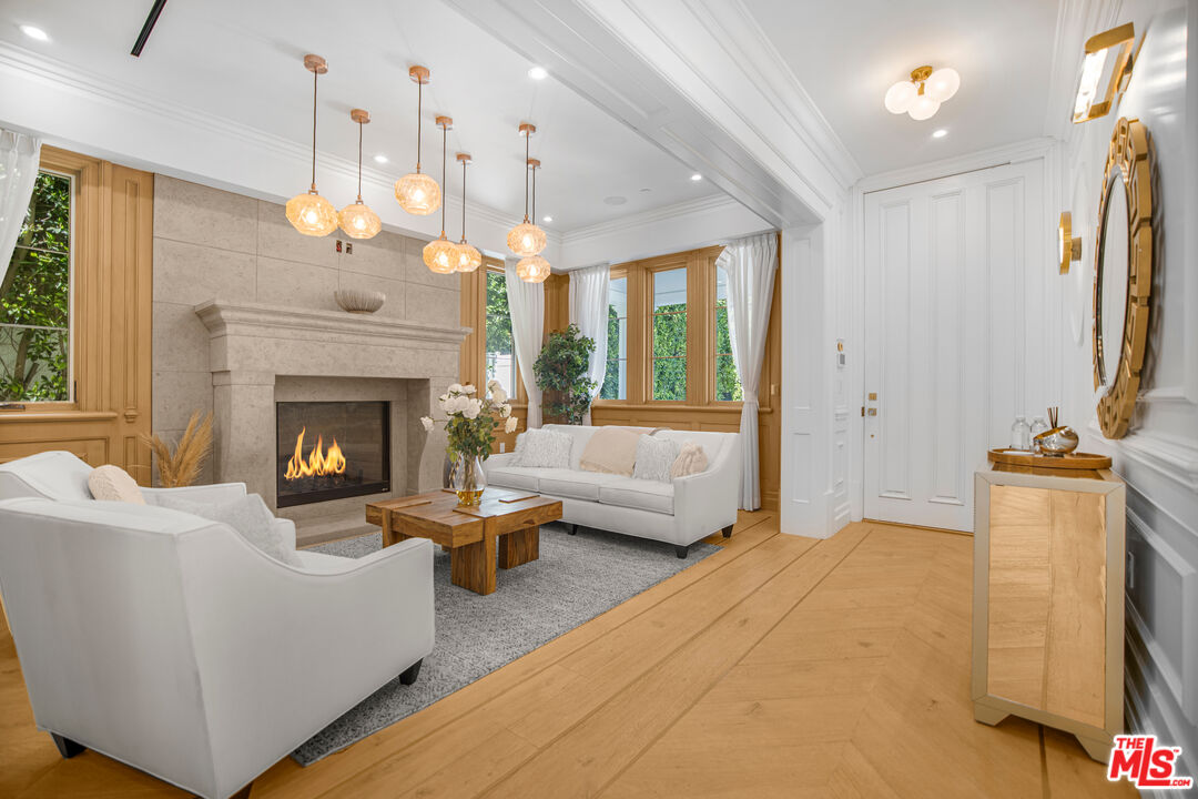 843 North Spaulding Avenue Los Angeles, CA 90046 - Photo 3 of 24 a living room with furniture and a fireplace