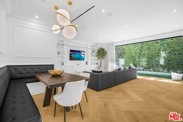 a kitchen with a table and chairs in it