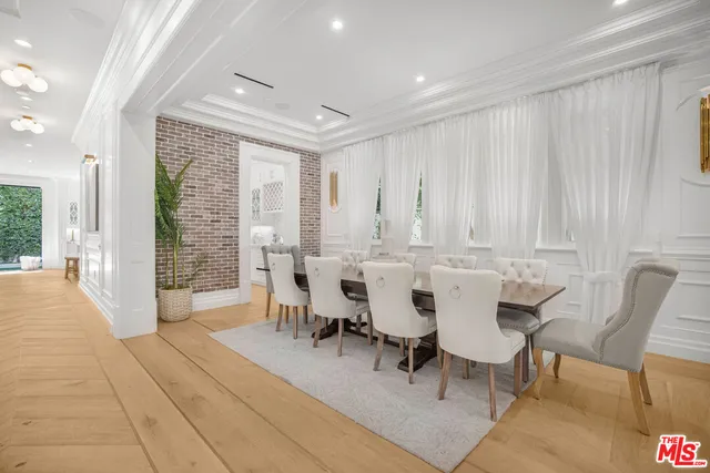 a view of a a dining room with furniture window and outside view