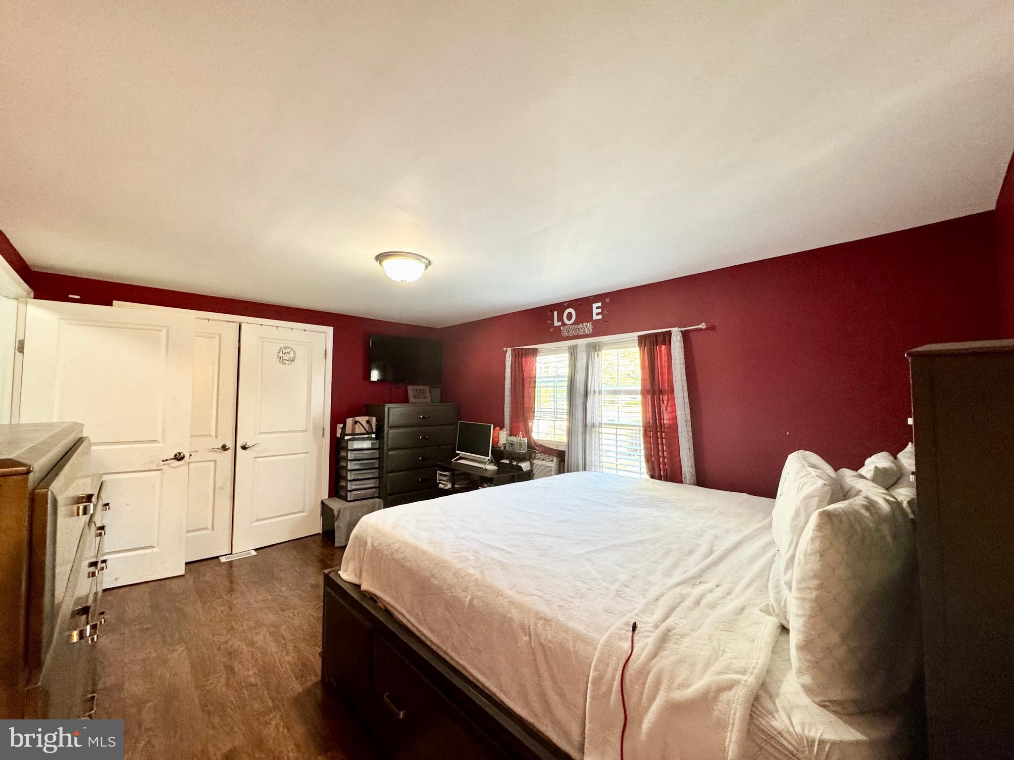 134 Liberty Way Fruitland, MD 21826 - Photo 14 of 25 a bedroom with a large bed and a large window