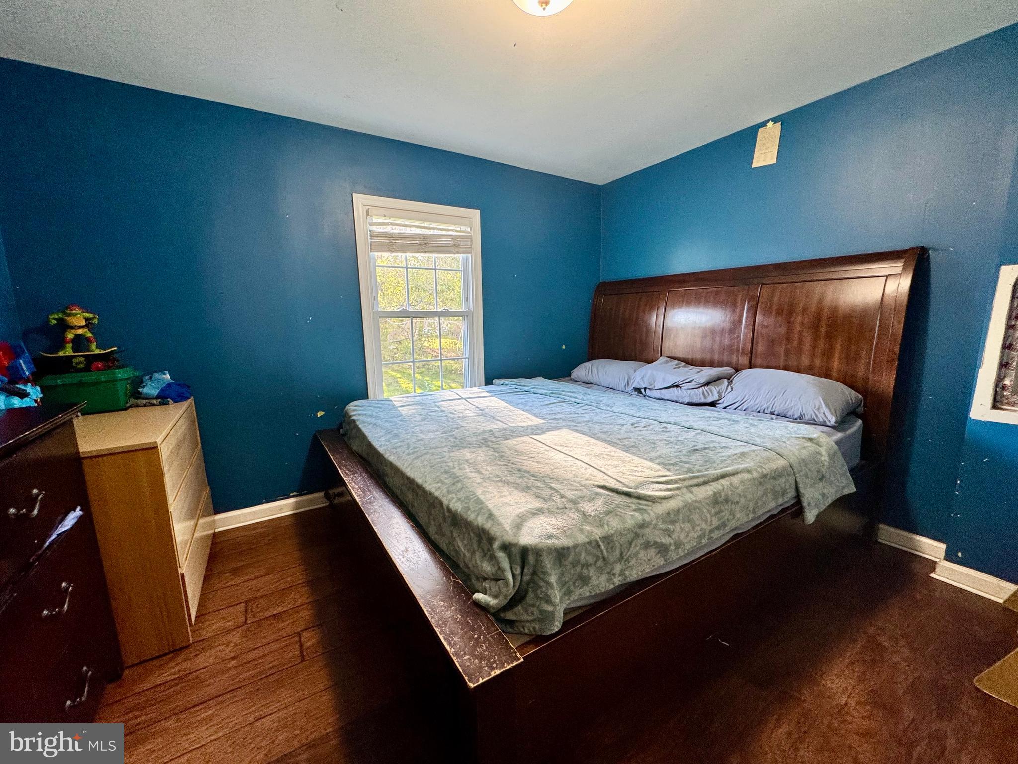 134 Liberty Way Fruitland, MD 21826 - Photo 17 of 25 a bedroom with a bed and wooden floor