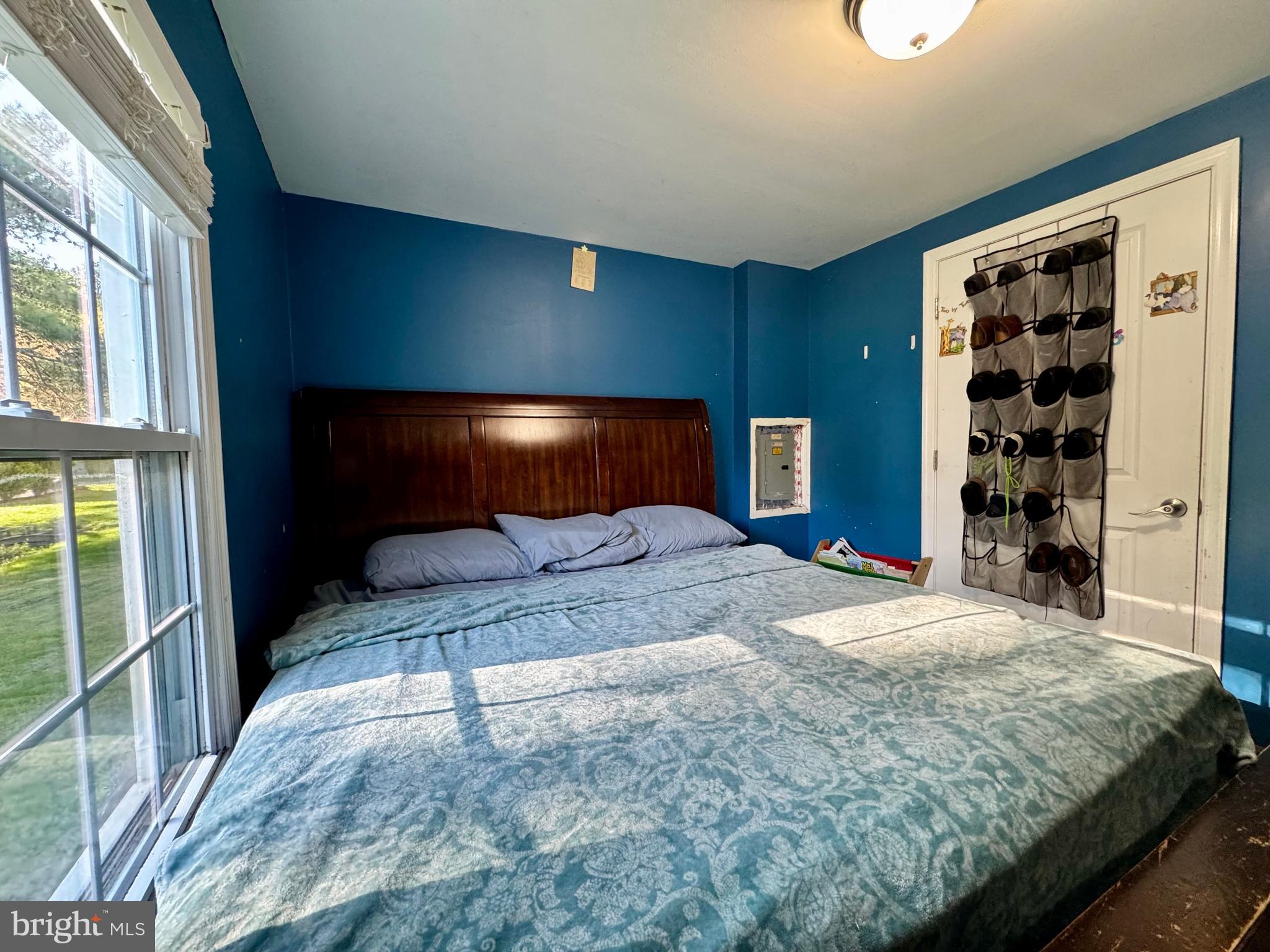 134 Liberty Way Fruitland, MD 21826 - Photo 18 of 25 a bedroom with a large bed and a window