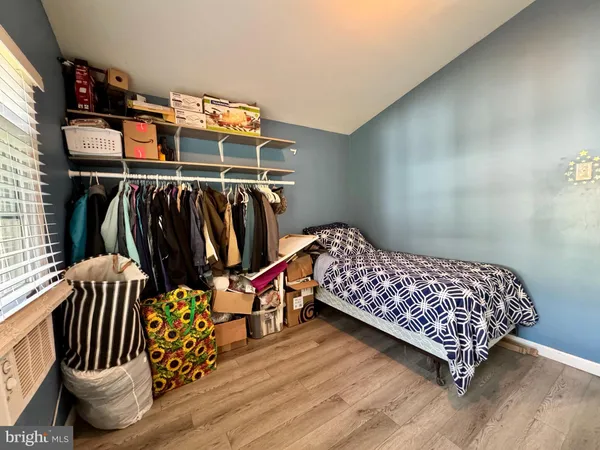 a bedroom with two beds and a window