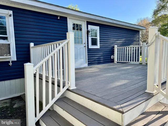 a view of a wooden door of the house