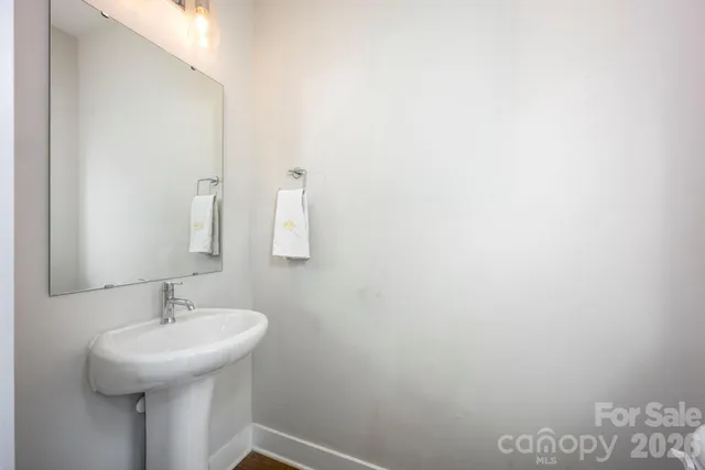 a bathroom with a sink and mirror