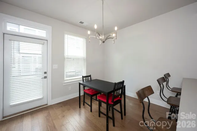a view of a room with furniture window and wooden floor