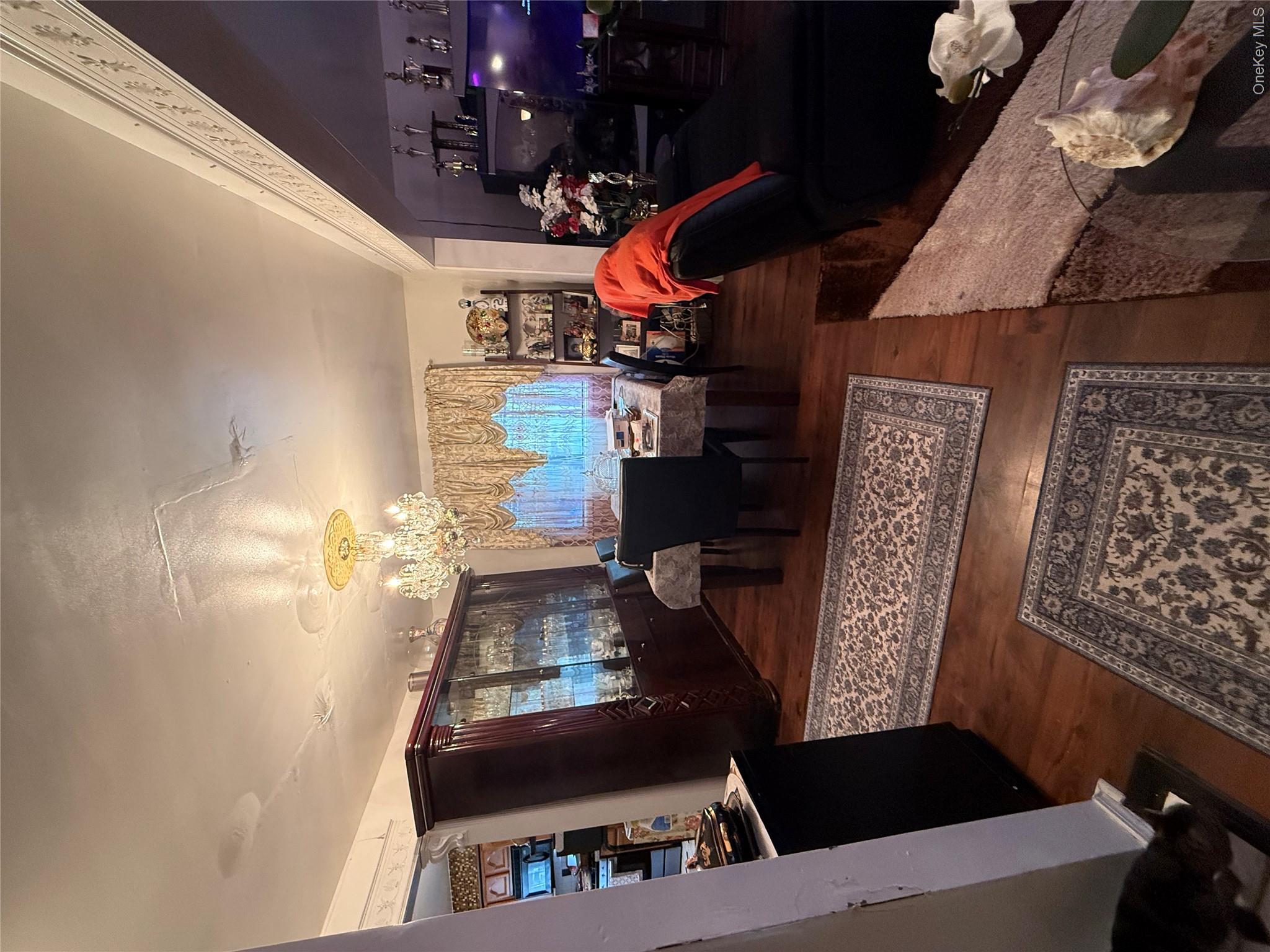 22 Slinn Avenue Spring Valley, NY 10977 - Photo 4 of 11 a living room with furniture a rug and a piano