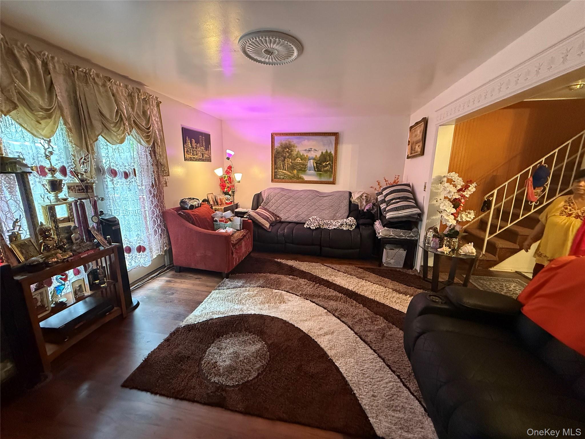 22 Slinn Avenue Spring Valley, NY 10977 - Photo 7 of 11 a living room with furniture and a flat screen tv
