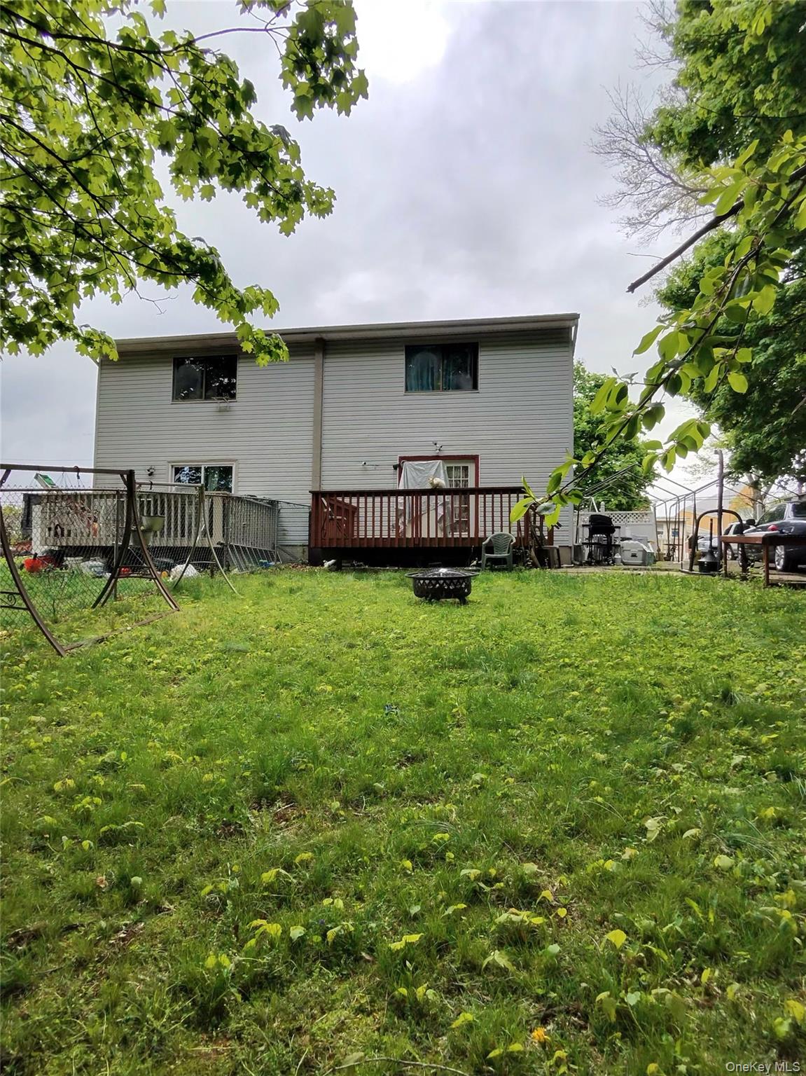 22 Slinn Avenue Spring Valley, NY 10977 - Photo 10 of 11 a view of house with yard and outdoor seating