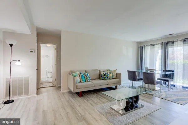 a view of a livingroom with furniture and a window