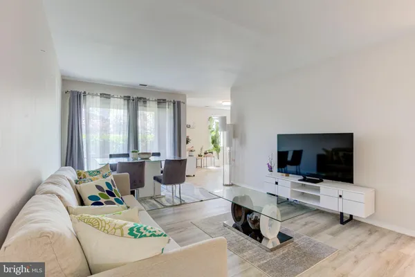 a view of a workspace with furniture and a couch