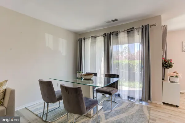 a bathroom with a tub a toilet and a shower