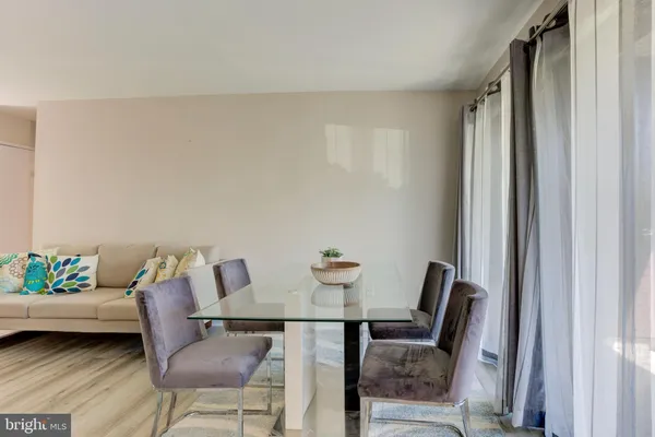 a bathroom with a sink vanity mirror and toilet