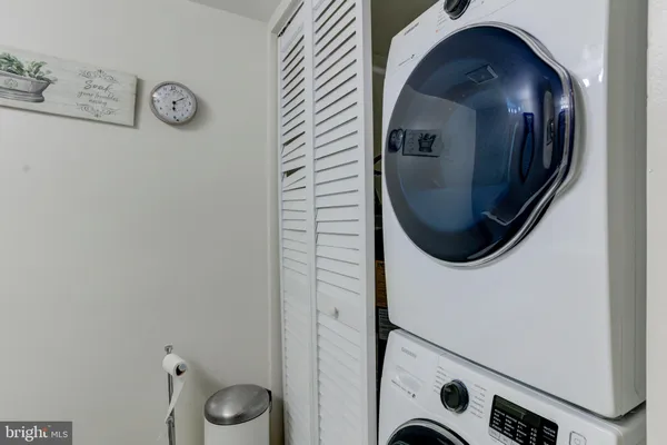 a bed room with a bed and a night stand