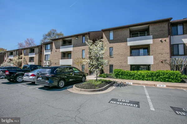 a kitchen with stainless steel appliances a refrigerator and a refrigerator