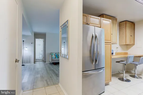 a kitchen with stainless steel appliances a sink and cabinets
