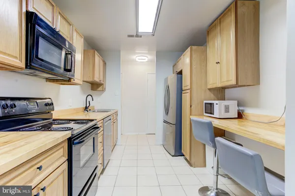 a kitchen with a stove and a microwave