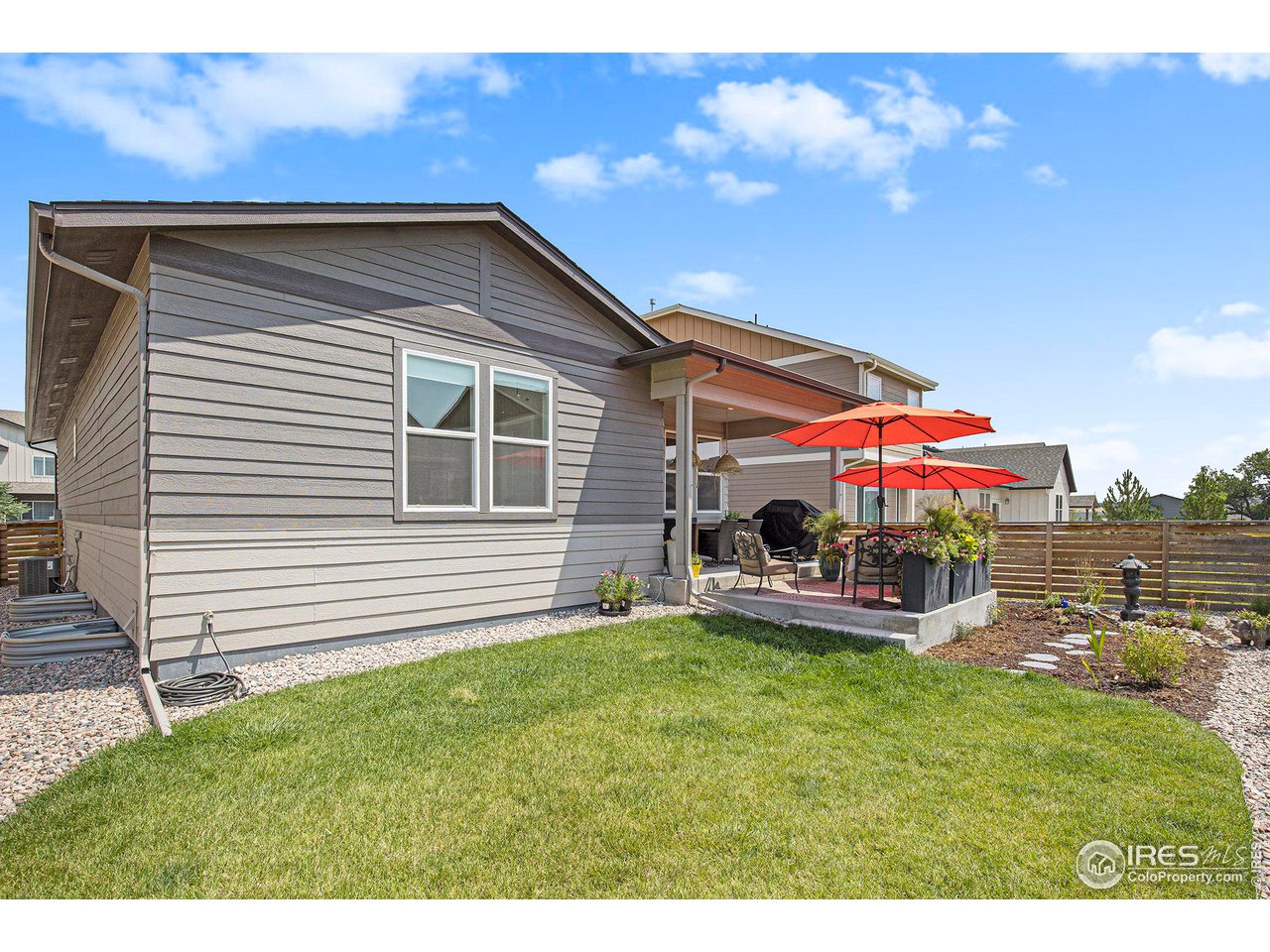 6618 4th St Road Greeley, CO 80634 - Photo 21 of 21 Landscaped backyard with sprinkler system