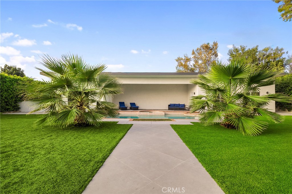 17153 Rayen Street Northridge, CA 91325 - Photo 14 of 75 a view of a garden with a building in the background