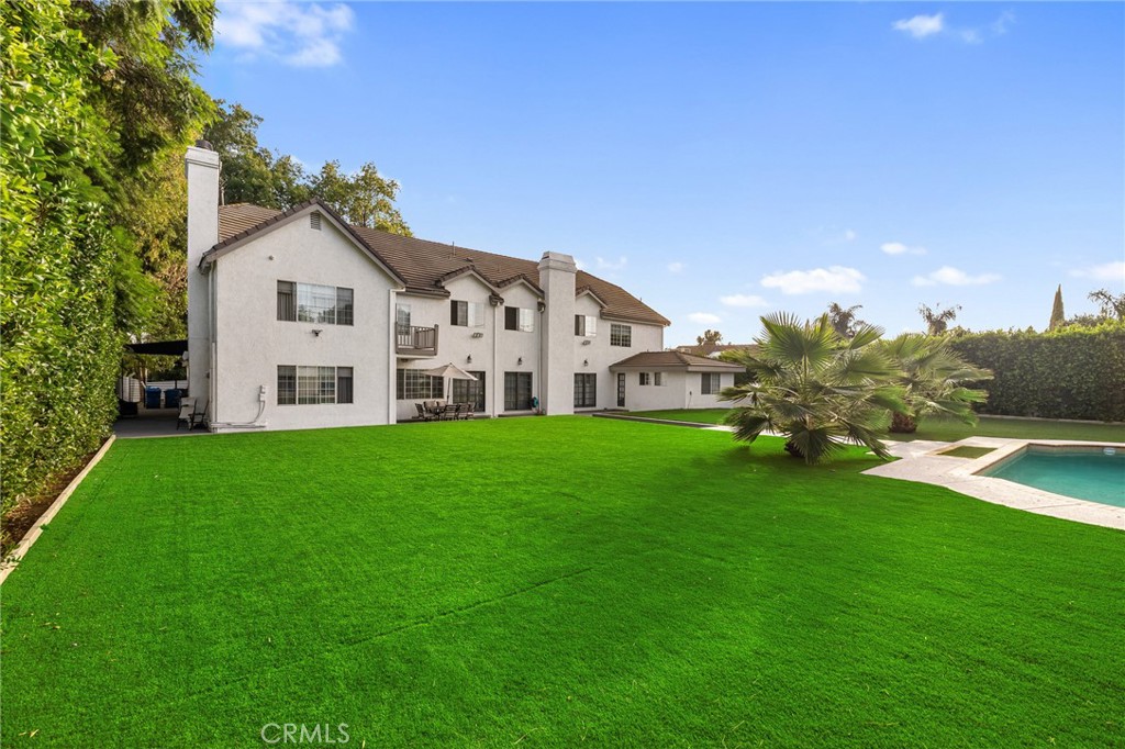 17153 Rayen Street Northridge, CA 91325 - Photo 15 of 75 a view of a house with garden and trees