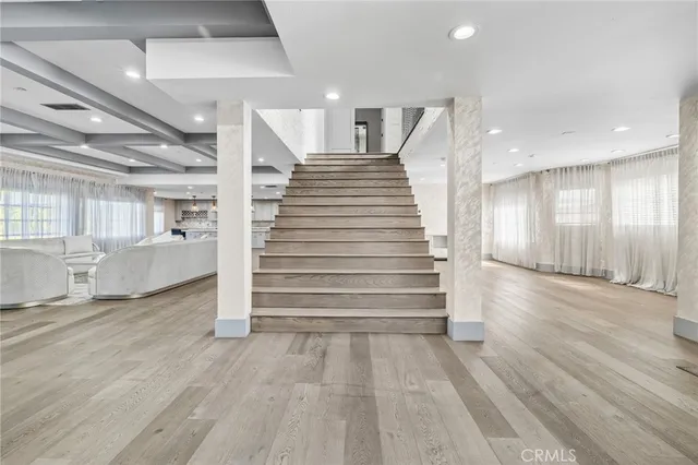 a living room with couches and a large window