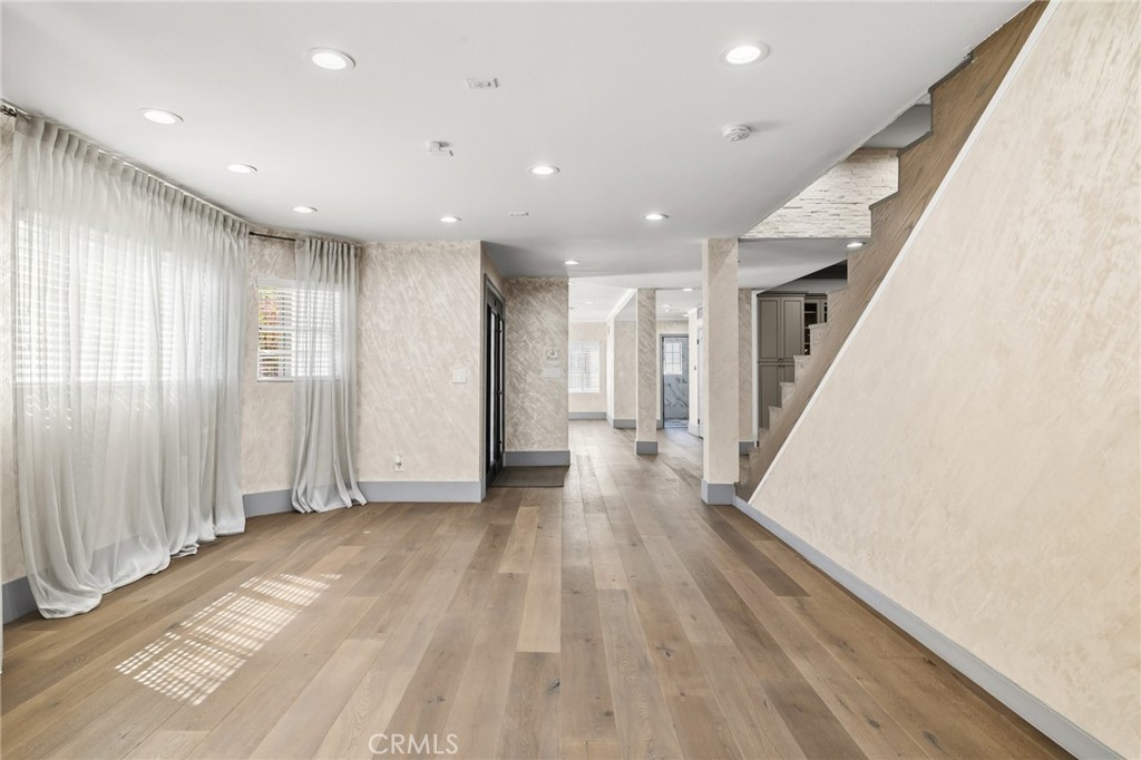 17153 Rayen Street Northridge, CA 91325 - Photo 21 of 75 a view of empty room with wooden floor