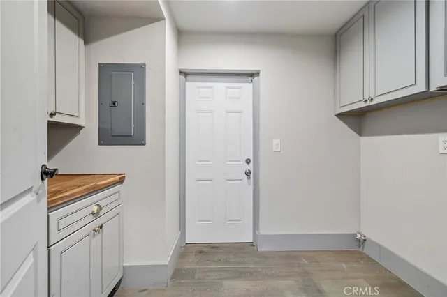 a kitchen with granite countertop a sink stainless steel appliances and cabinets