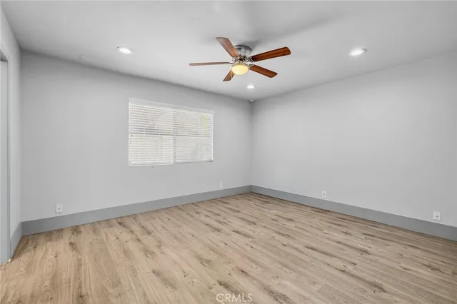 a white stove top oven sitting inside of a kitchen
