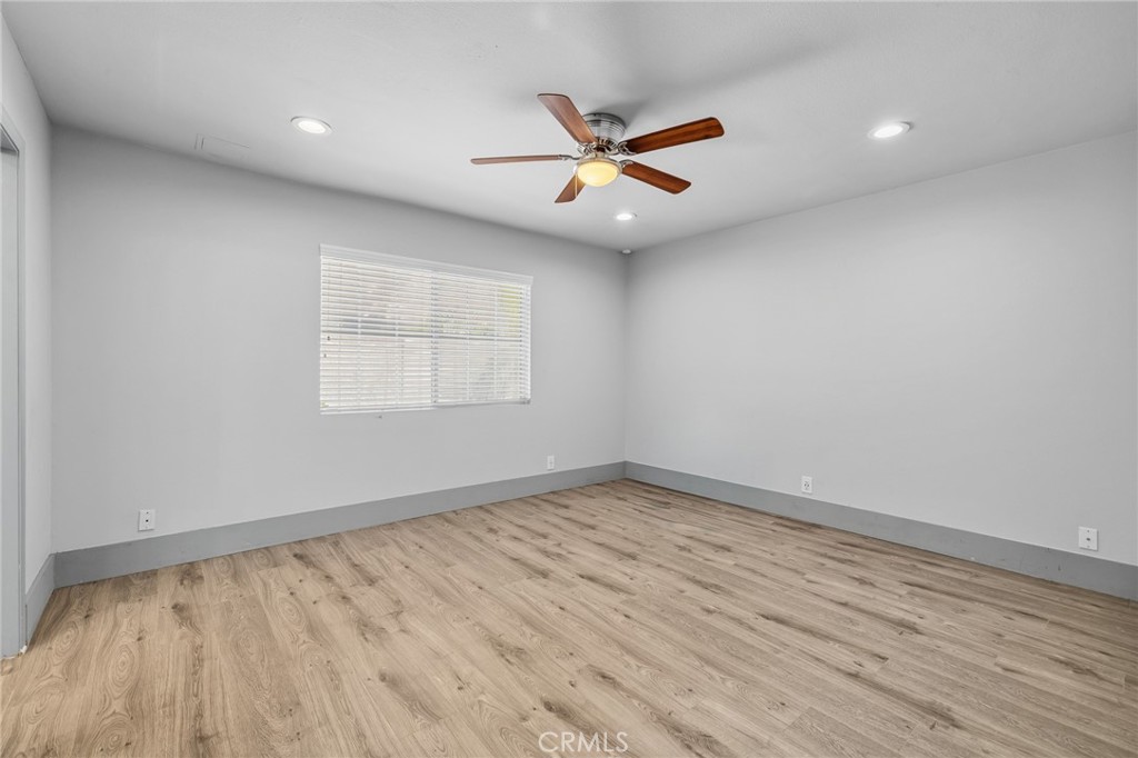 17153 Rayen Street Northridge, CA 91325 - Photo 23 of 75 wooden floor in an empty room with a window