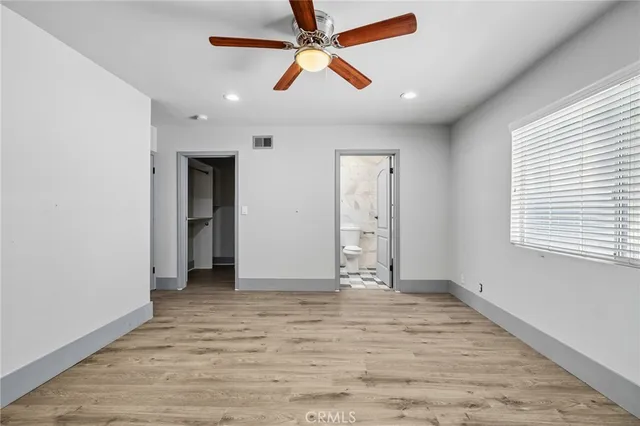 a kitchen with a table and chairs in it