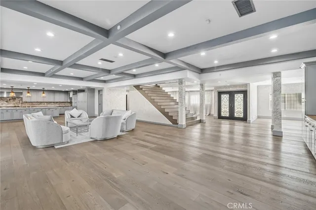 a view of a dining room with furniture and a wooden floor