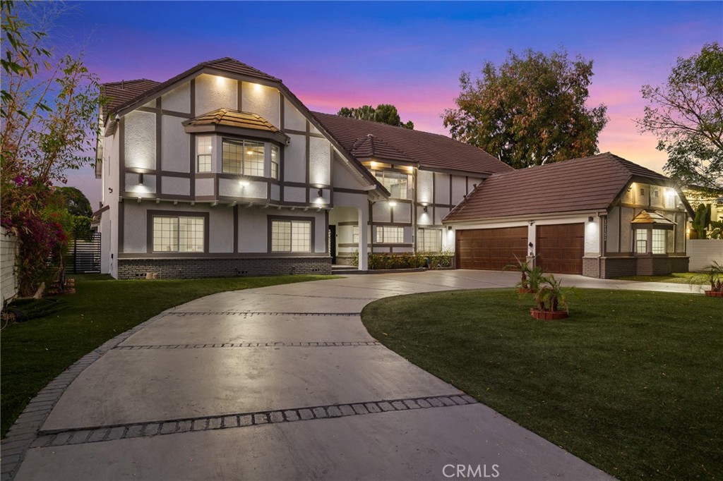 17153 Rayen Street Northridge, CA 91325 - Photo 3 of 75 a front view of a house with a yard