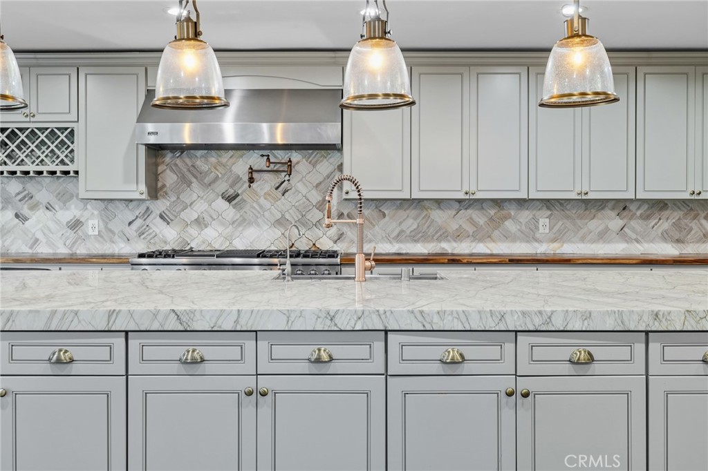 17153 Rayen Street Northridge, CA 91325 - Photo 39 of 75 a sink sitting inside of a kitchen