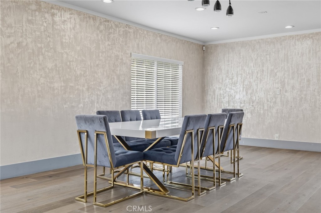 17153 Rayen Street Northridge, CA 91325 - Photo 40 of 75 a view of a dining room with furniture and wooden floor