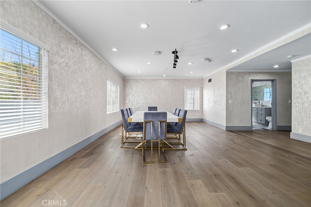 17153 Rayen Street Northridge, CA 91325 - Photo 41 of 75 a view of a dining room with furniture and wooden floor