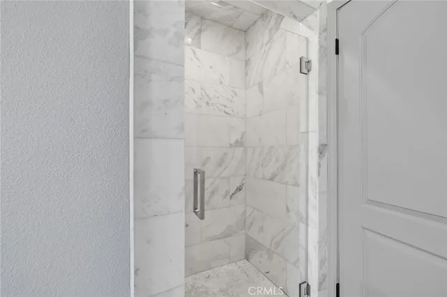 a view of a swimming pool with a lounge chair