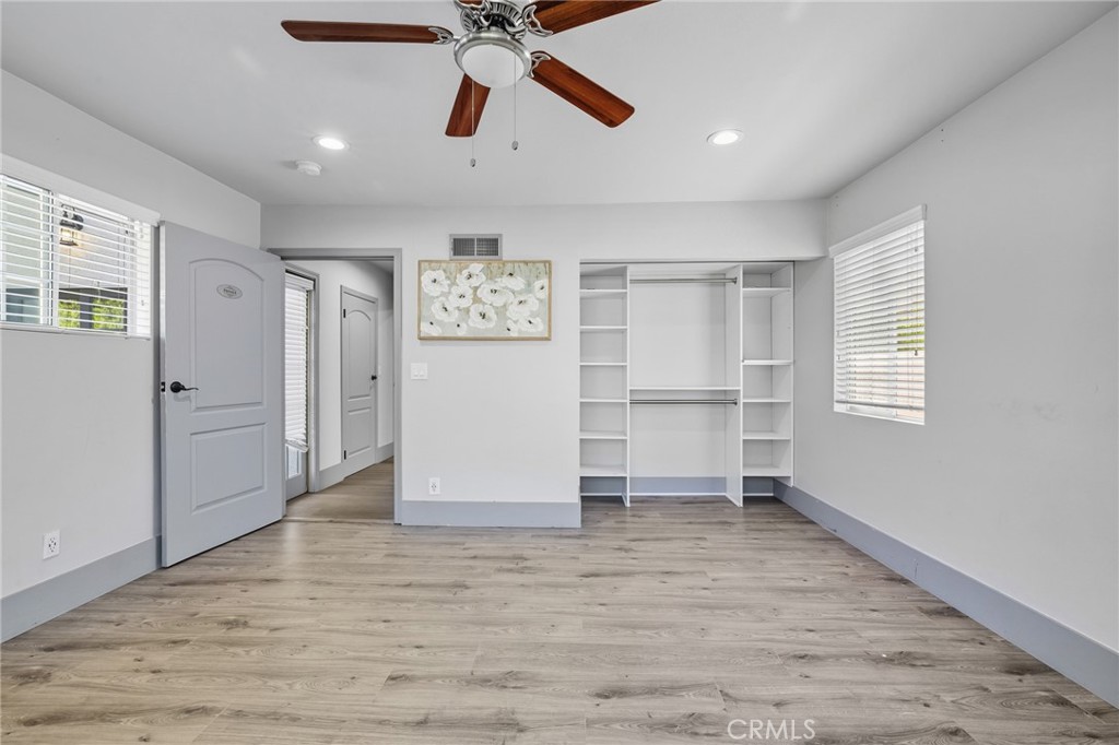 17153 Rayen Street Northridge, CA 91325 - Photo 48 of 75 a view of empty room with wooden floor and window