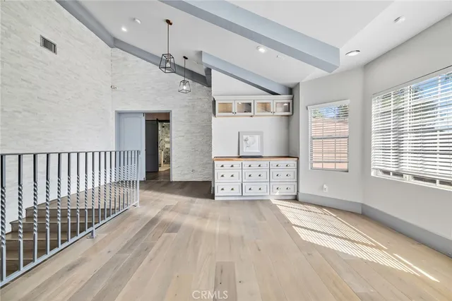 a view of a swimming pool with a chair and tables
