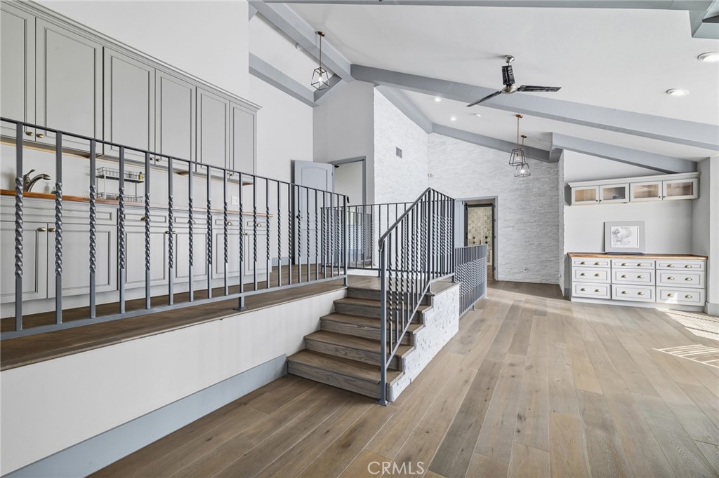 17153 Rayen Street Northridge, CA 91325 - Photo 55 of 75 a view of hallway with stairs and wooden floor
