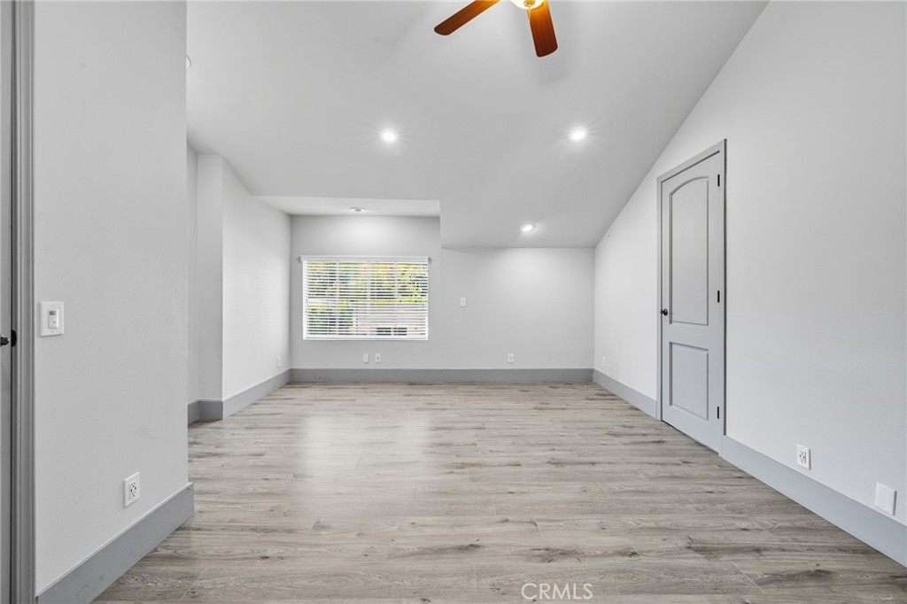 17153 Rayen Street Northridge, CA 91325 - Photo 56 of 75 an empty room with windows and natural light