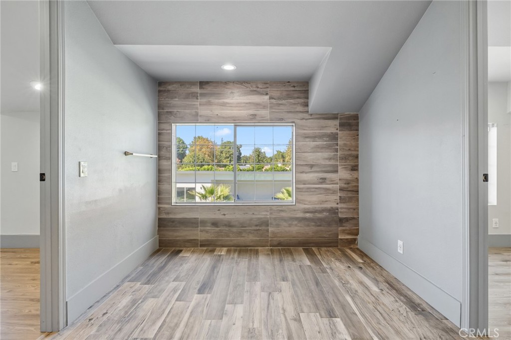 17153 Rayen Street Northridge, CA 91325 - Photo 57 of 75 a view of room with window and wooden floor