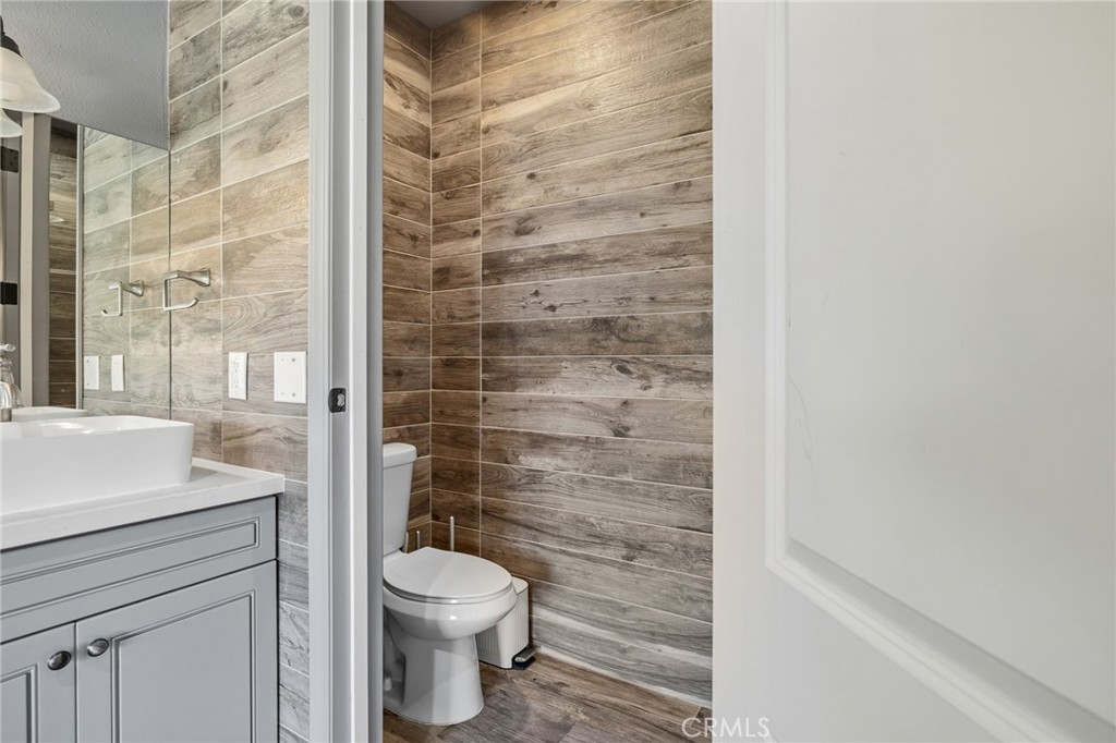 17153 Rayen Street Northridge, CA 91325 - Photo 60 of 75 a bathroom with a toilet and a shower