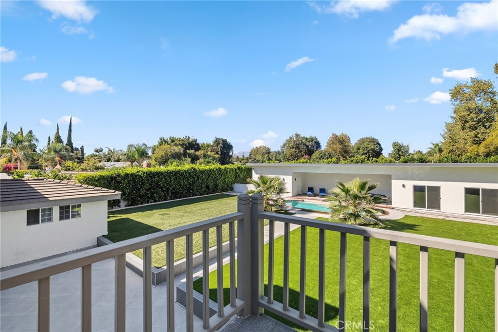 17153 Rayen Street Northridge, CA 91325 - Photo 68 of 75 a view of a deck with two chair and a table