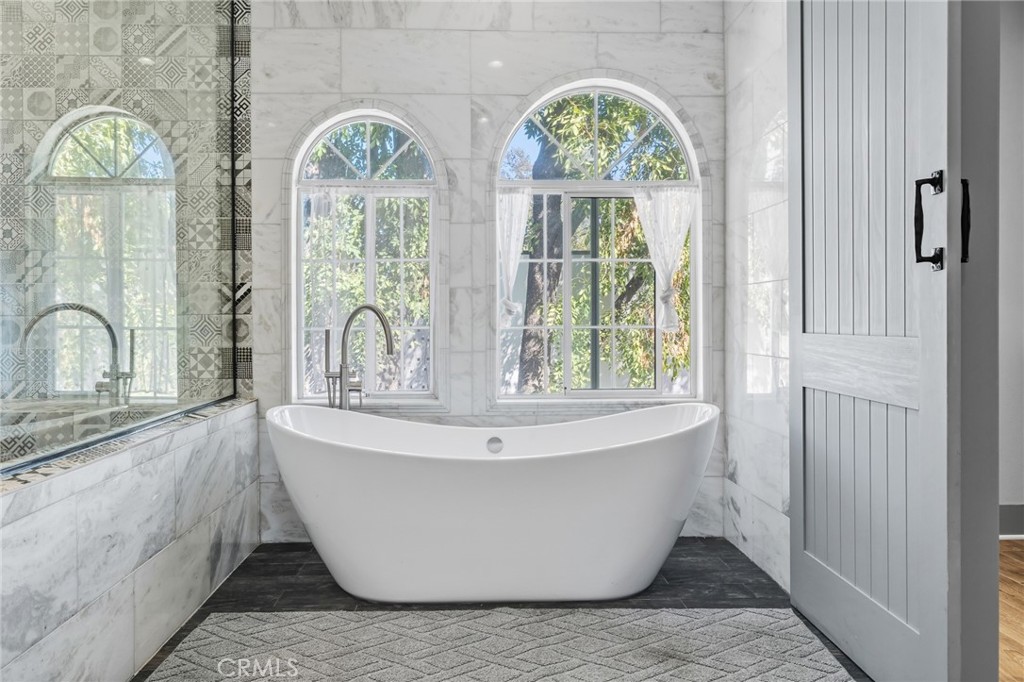 17153 Rayen Street Northridge, CA 91325 - Photo 69 of 75 a white bath tub sitting next to a window