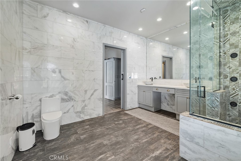 17153 Rayen Street Northridge, CA 91325 - Photo 74 of 75 a bathroom with a sink a toilet and shower