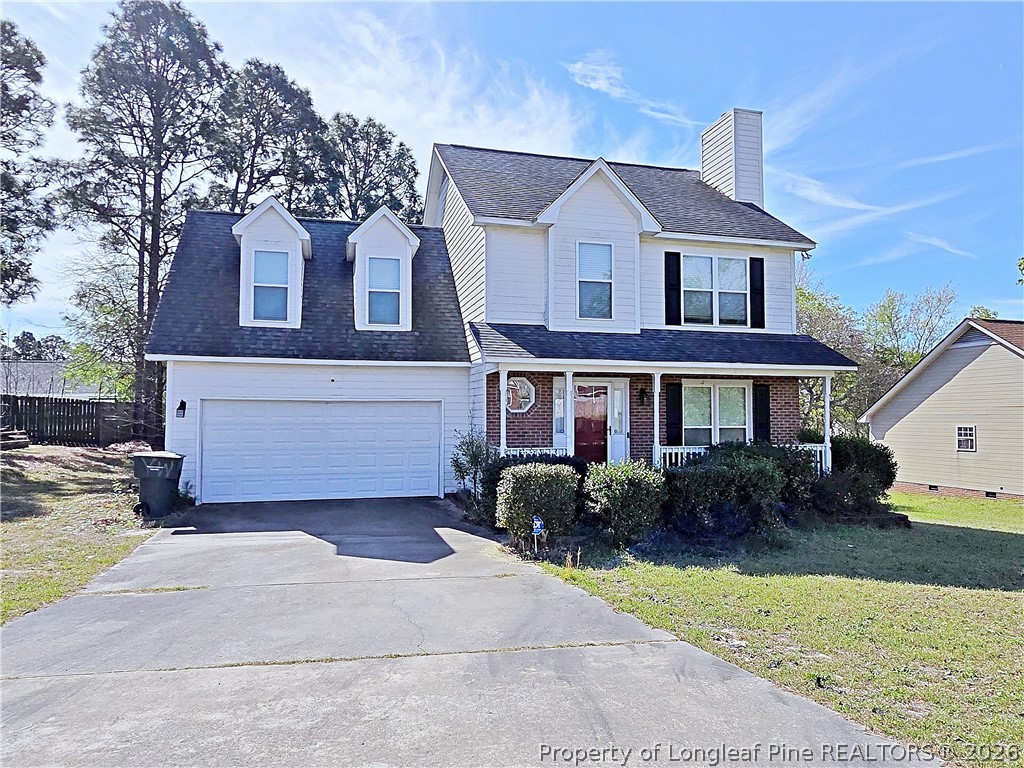 5218 Pringle Way Hope Mills, NC 28348 - Photo 1 of 43 a front view of a house with garden