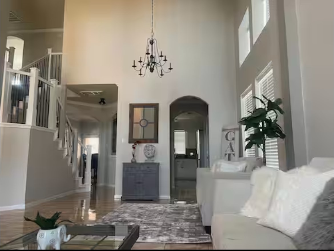 1923 Kaitlyn Drive Houston, TX 77049 - Photo 2 of 22 a living room with furniture and a chandelier