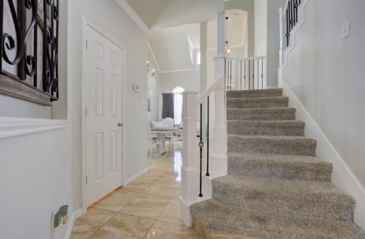 1923 Kaitlyn Drive Houston, TX 77049 - Photo 5 of 22 a view of an entryway with staircase