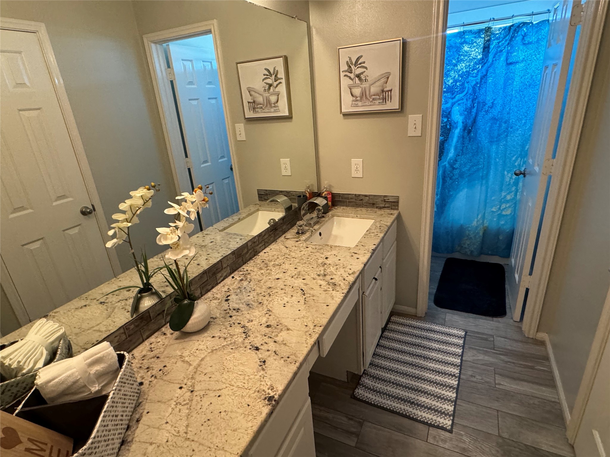1923 Kaitlyn Drive Houston, TX 77049 - Photo 6 of 22 a bathroom with a granite countertop sink and a mirror