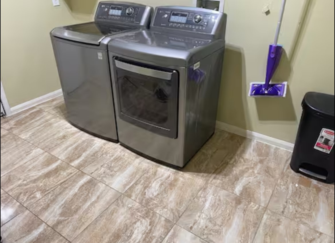 1923 Kaitlyn Drive Houston, TX 77049 - Photo 8 of 22 a utility room with dryer and washer